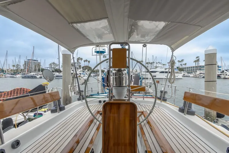 Slide: The Image of Cockpit view of a 1994 Farr 55 yacht docked in a marina. - 21