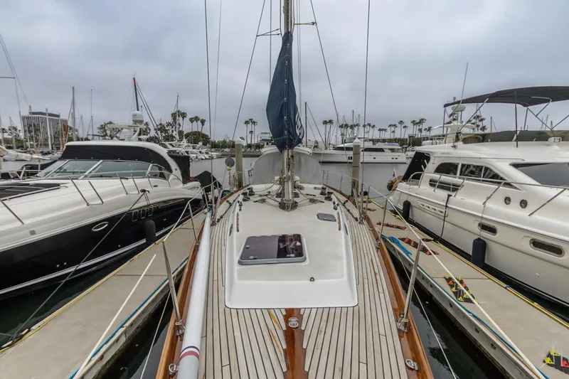 Slide: The Image of Farr 55 sailboat from 1994 docked among other yachts in a marina. - 25