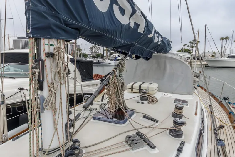 Slide: The Image of 1994 Farr 55 sailboat deck with rigging and winches in marina. - 28