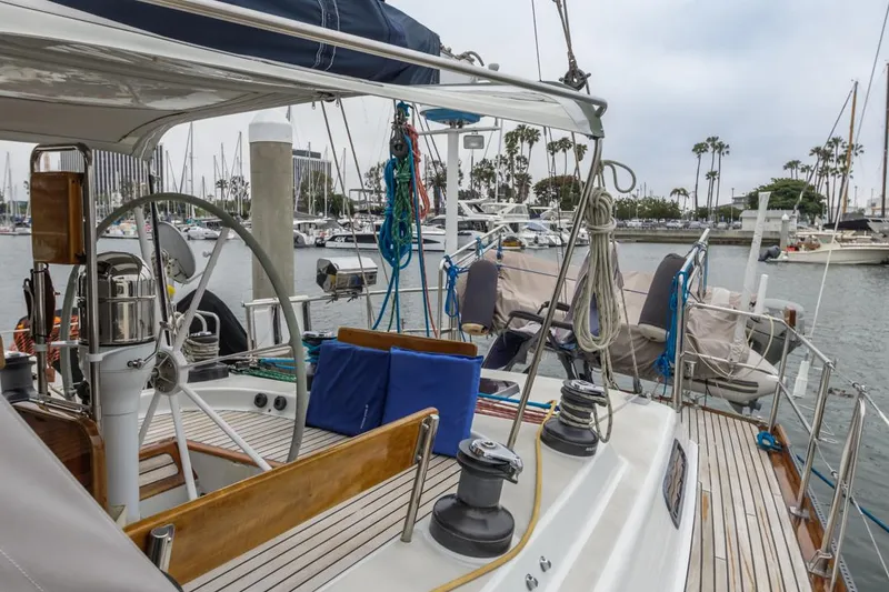 Slide: The Image of Sailboat Farr 55, 1994 model, docked in marina with visible deck and equipment. - 34