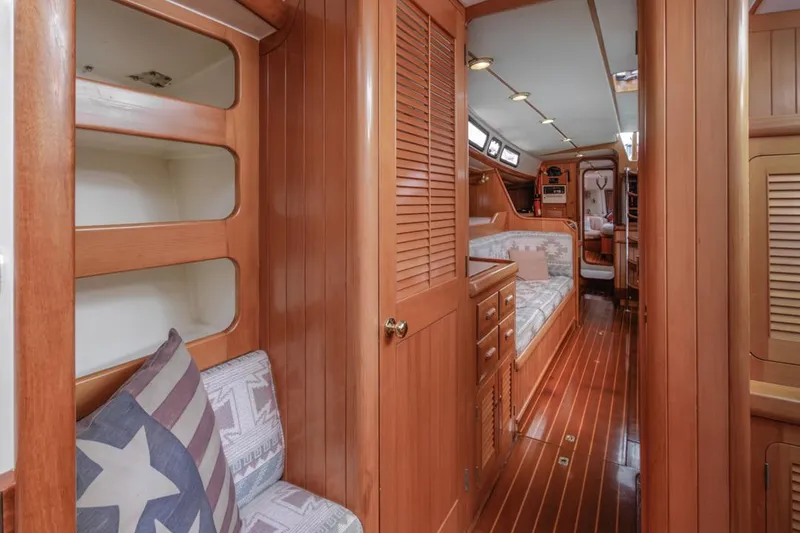 Slide: The Image of Interior of 1994 Farr 55 yacht with wooden finish and cozy seating area. - 36