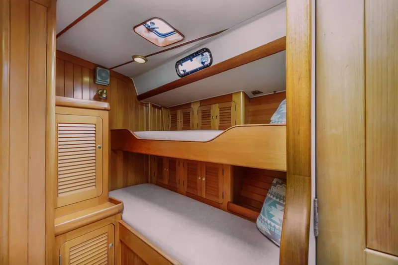 Slide: The Image of Cozy wooden cabin interior with bunk beds on a 1994 Farr 55 yacht. - 37