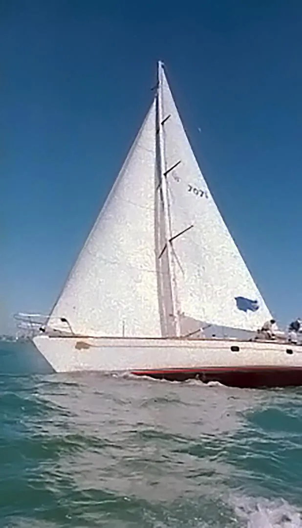 Slide: The Image of Sailing yacht Farr 55, 1994 model, gliding on clear blue waters. - 4