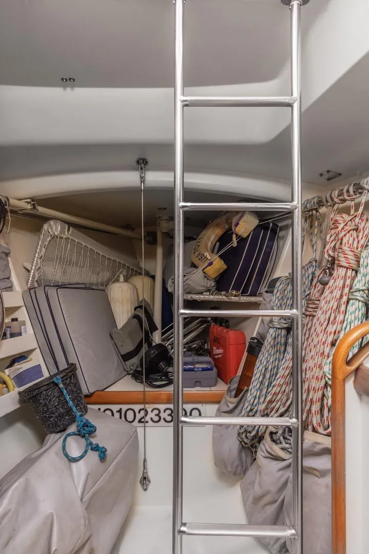 Slide: The Image of Interior of 1994 Farr 55 sailboat with ladder and stored equipment. - 40