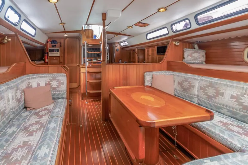 Slide: The Image of Spacious interior of 1994 Farr 55 yacht with wooden furnishings and cozy seating. - 42