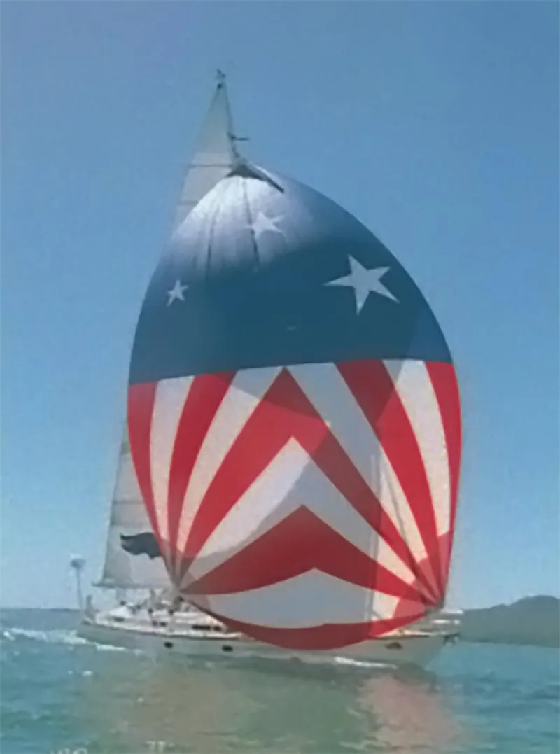 Slide: The Image of Sailing yacht Farr 55 (1994) with star-spangled spinnaker on open water. - 5