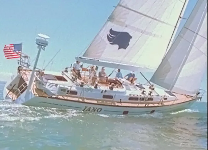 Slide: The Image of Sailing yacht Farr 55, 1994 model, cruising on open water with crew onboard. - 6