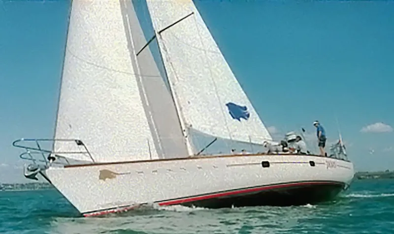 Slide: The Image of Sailing yacht Farr 55, 1994 model, gliding on clear blue waters. - 8