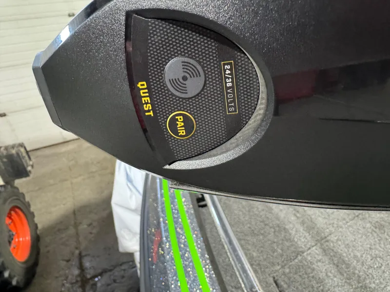 Slide: The Image of Close-up of Nitro ZV21 Pro 2024 boat control panel with Quest and Pair buttons. - 12