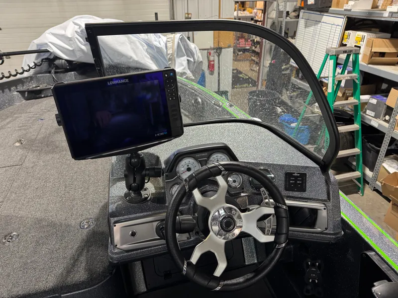 Slide: The Image of 2024 Nitro ZV21 Pro boat dashboard with steering wheel and navigation display. - 14