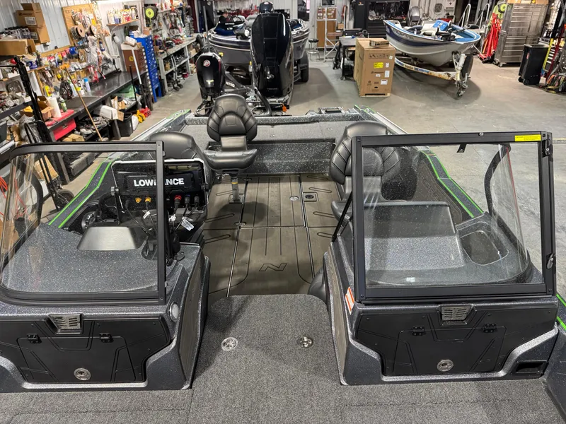 Slide: The Image of 2024 Nitro ZV21 Pro fishing boat interior in a showroom setting. - 8