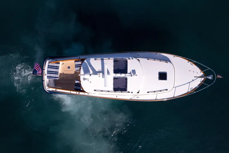 Slide: The Image of Aerial view of 2016 Hinckley 37 Picnic Boat cruising on water. - 37