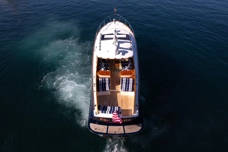 Slide: The Image of Hinckley 37 Picnic Boat 2016 cruising on open water, aerial view. - 39