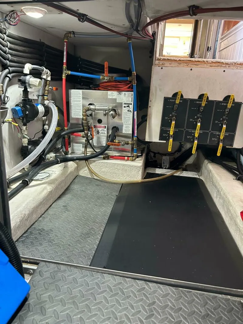 Slide: The Image of Engine room of 1996 Bayliner 4788 Pilot House Motoryacht with equipment and wiring. - 11