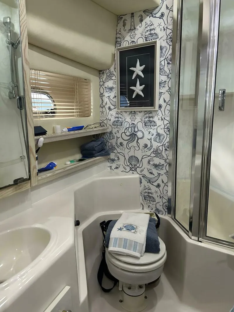 Slide: The Image of Bathroom in 1996 Bayliner 4788 Pilot House Motoryacht with nautical decor and shower. - 21