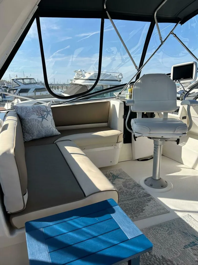 Slide: The Image of Interior of 1996 Bayliner 4788 Pilot House Motoryacht with seating and helm. - 30