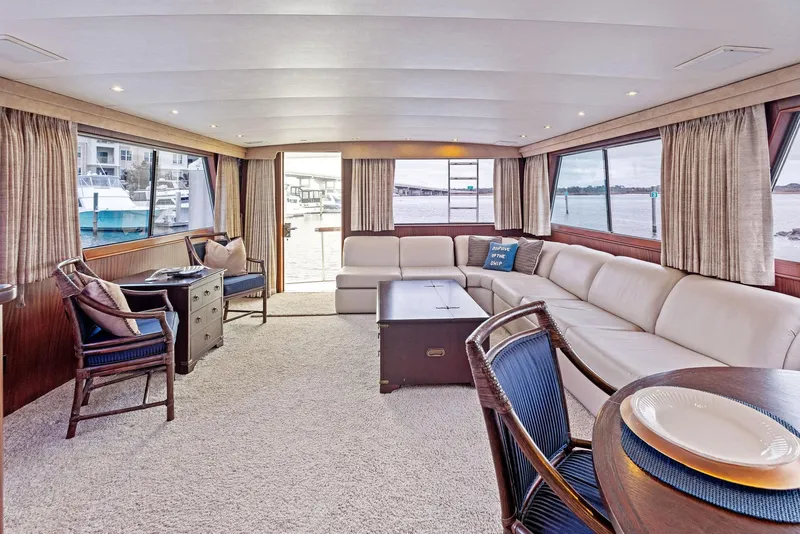 Slide: The Image of Luxurious interior of 1987 Hatteras 68 Cockpit Motor Yacht with spacious seating and elegant decor. - 14