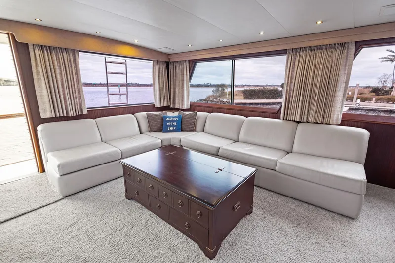 Slide: The Image of Luxurious interior of 1987 Hatteras 68 Cockpit Motor Yacht with spacious seating and large windows. - 16