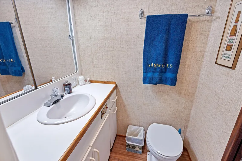 Slide: The Image of Bathroom interior of 1987 Hatteras 68 Cockpit Motor Yacht with sink and toilet. - 30