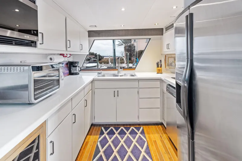 Slide: The Image of Modern kitchen in 1987 Hatteras 68 Cockpit Motor Yacht with stainless steel appliances. - 34