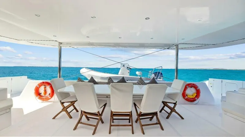 Slide: The Image of Luxurious 2023 Mystique Yachts Silhouette 800 deck with ocean view and elegant seating. - 14