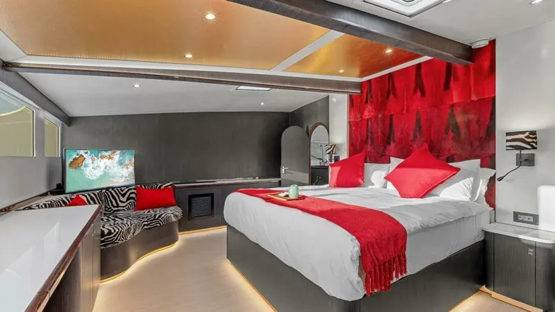 Slide: The Image of Luxurious bedroom in 2023 Mystique Yachts Silhouette 800 with modern decor and vibrant red accents. - 20