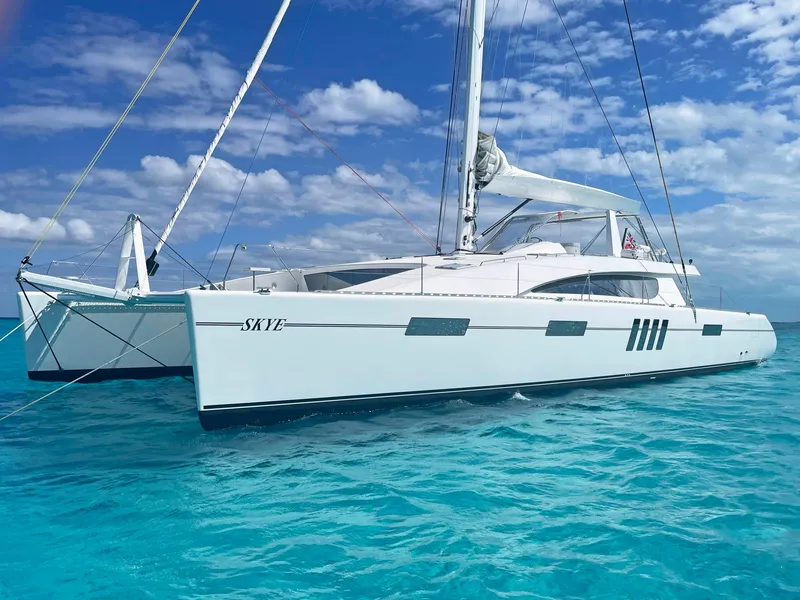 Slide: The Image of Custom Mystique Yachts Silhouette 800, 2023 model, sailing on clear turquoise waters. - 4