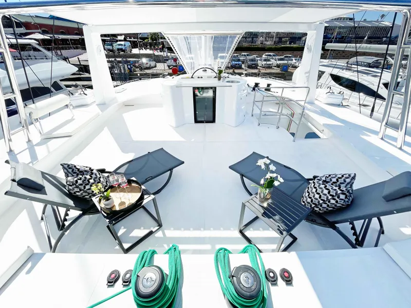 Slide: The Image of Luxurious 2023 Mystique Yachts Silhouette 800 deck with lounge chairs and modern amenities. - 9