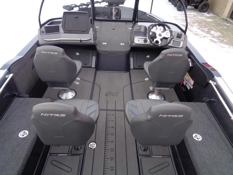 Slide: The Image of Interior of 2025 Nitro ZV20 Pro boat with four seats and modern dashboard. - 6