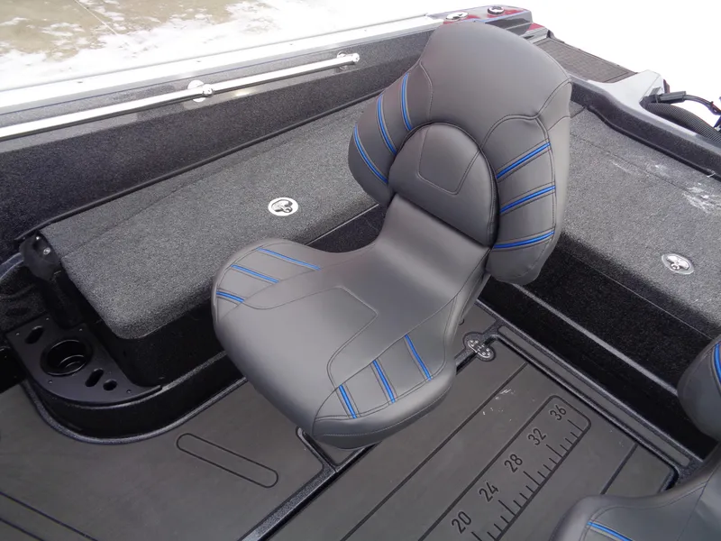 Slide: The Image of Nitro ZV20 Pro 2025 boat seat with blue accents and measuring ruler on floor. - 8