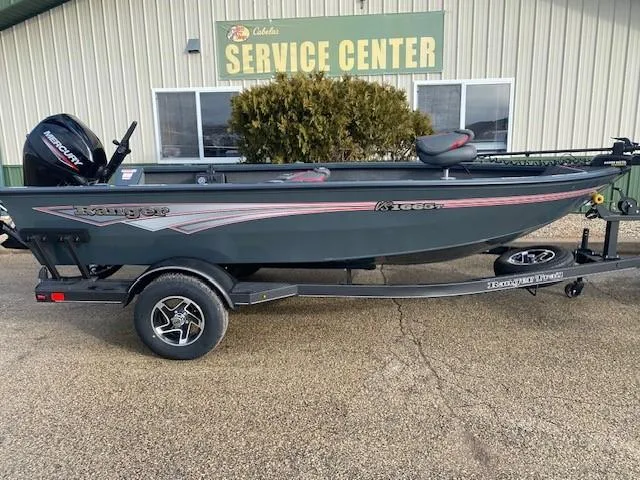 The Image of 2025 Ranger VS1665T fishing boat on trailer outside service center. - 0