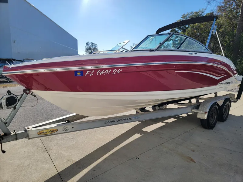 The Image of 2016 Chaparral Vortex 223 VRX boat on trailer, red and white design. - 1