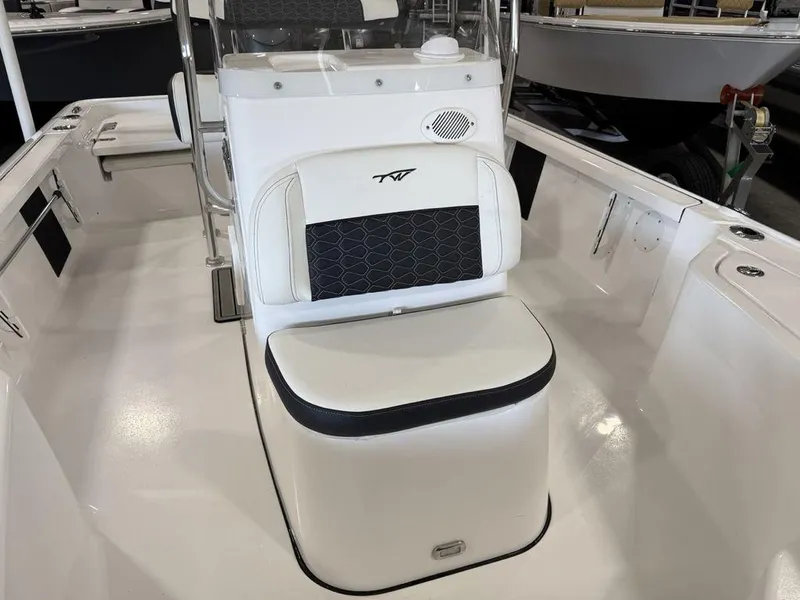 Slide: The Image of 2025 Tidewater 1910 BM boat interior with white seating and black accents. - 10