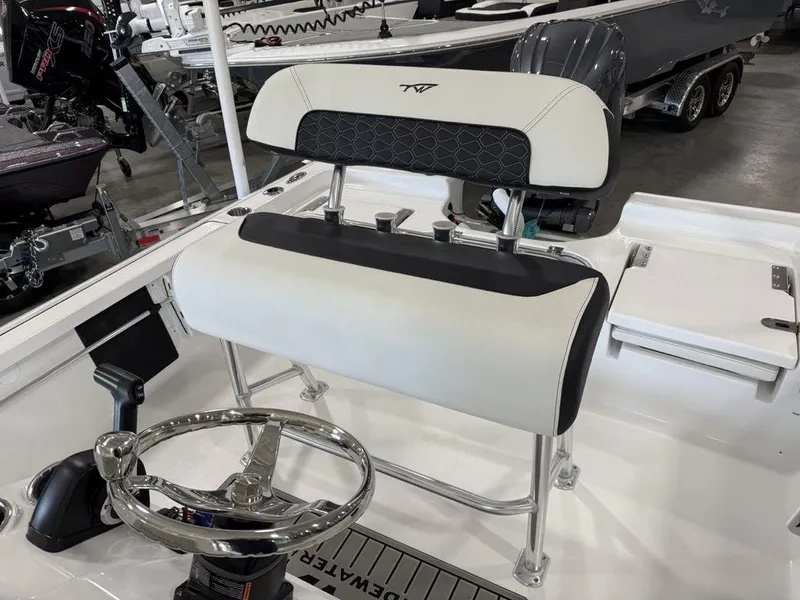 Slide: The Image of Tidewater 1910 BM 2025 boat interior with steering wheel and seating. - 14