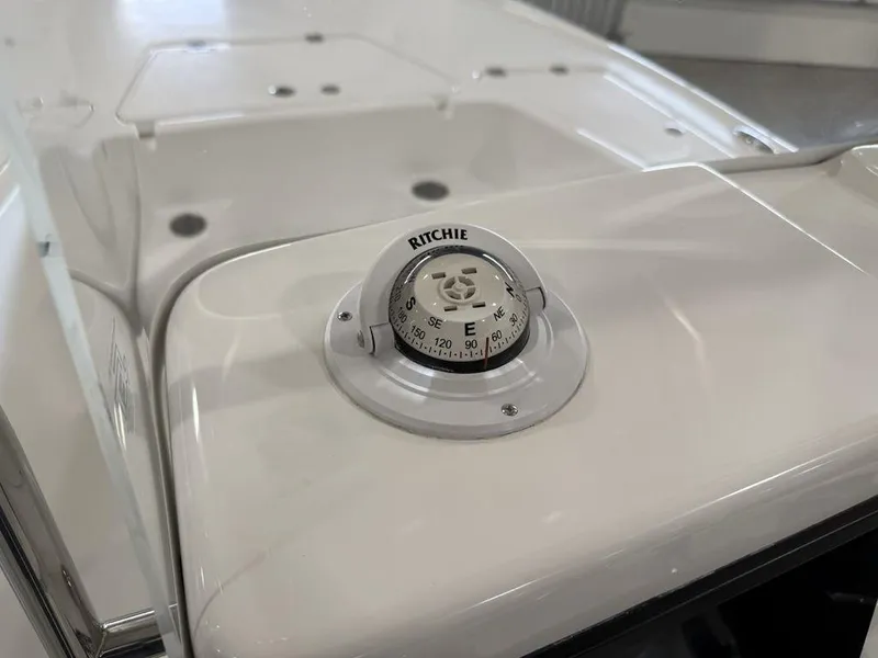 Slide: The Image of Compass on 2025 Tidewater 1910 BM boat dashboard. - 17
