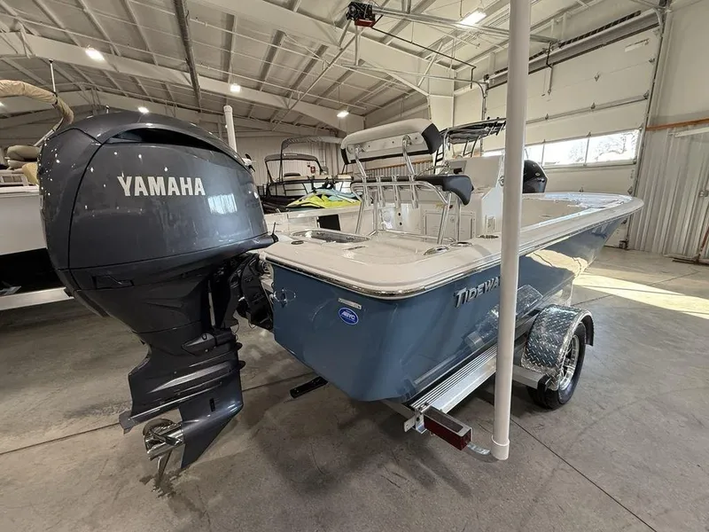 Slide: The Image of 2025 Tidewater 1910 BM boat with Yamaha engine in a showroom. - 2