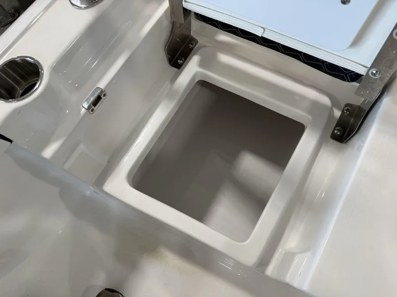 Slide: The Image of Tidewater 1910 BM 2025 boat storage compartment with stainless steel cup holders. - 20