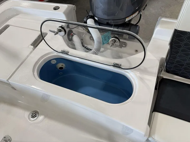 Slide: The Image of 2025 Tidewater 1910 BM boat with open livewell and motor in view. - 21