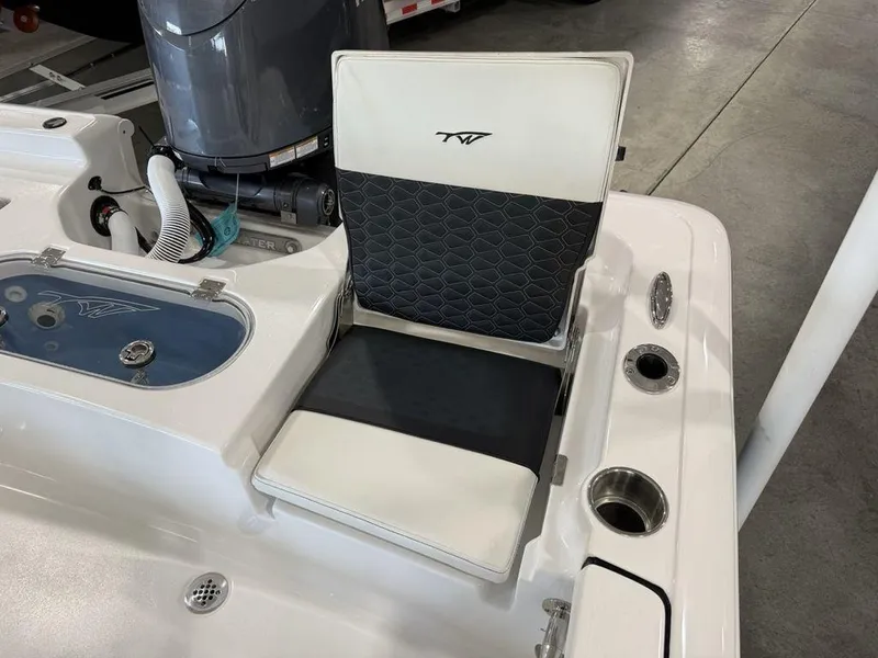 Slide: The Image of 2025 Tidewater 1910 BM boat seat with cup holders and storage compartment. - 22