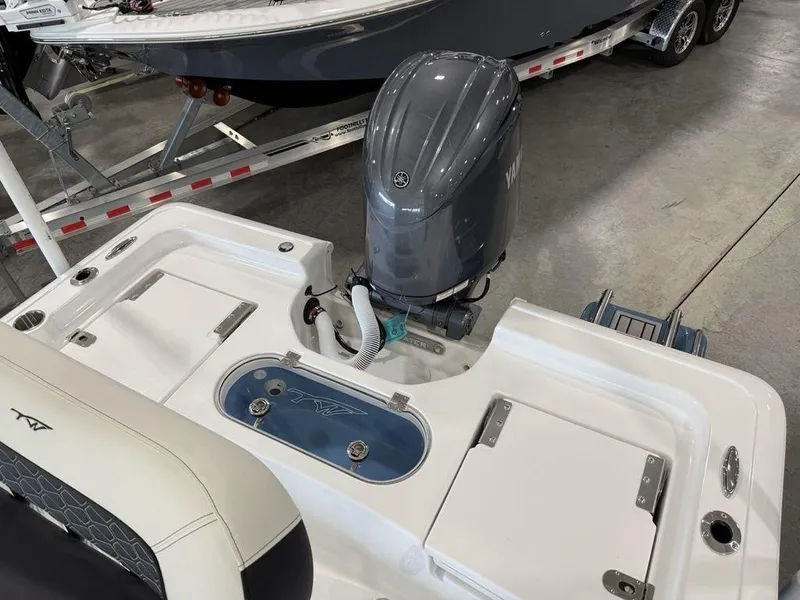 Slide: The Image of 2025 Tidewater 1910 BM boat with outboard motor in showroom. - 23