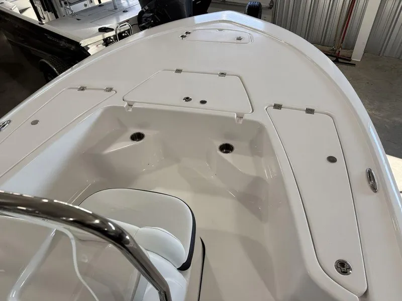 Slide: The Image of 2025 Tidewater 1910 BM boat interior with storage compartments and seating. - 5