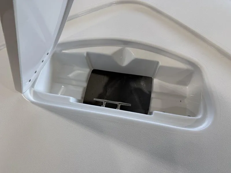 Slide: The Image of Tidewater 1910 BM 2025 boat compartment with open hatch and cleat. - 6