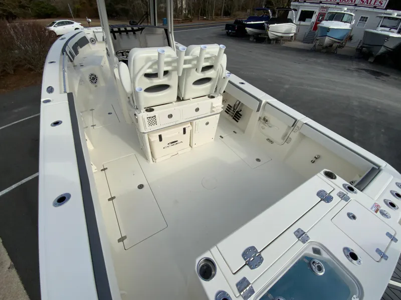 Slide: The Image of 2025 Cobia 285 Open Center Console boat interior with seating and storage. - 12