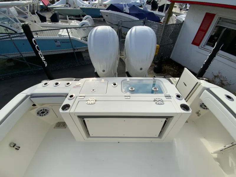 Slide: The Image of 2025 Cobia 285 Open Center Console boat with dual engines and fishing setup. - 15