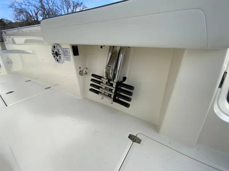 Slide: The Image of 2025 Cobia 285 Open Center Console boat interior with ladder and speaker. - 29
