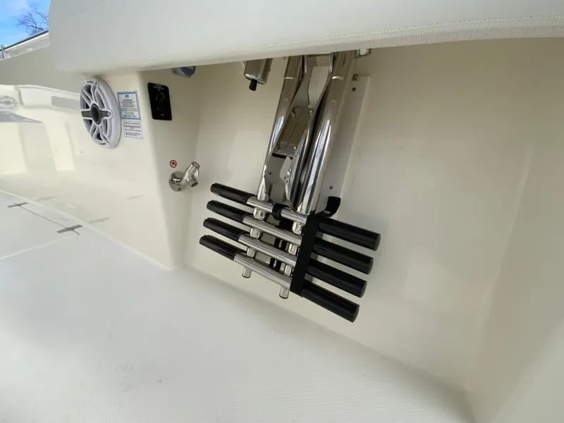 Slide: The Image of 2025 Cobia 285 Open Center Console boat ladder and speaker detail. - 30