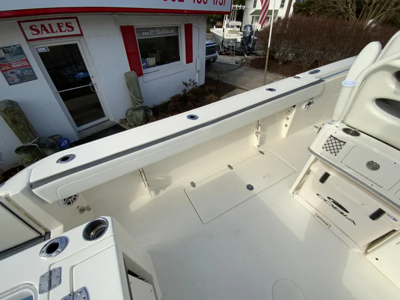Slide: The Image of 2025 Cobia 285 Open Center Console boat interior at sales location. - 33