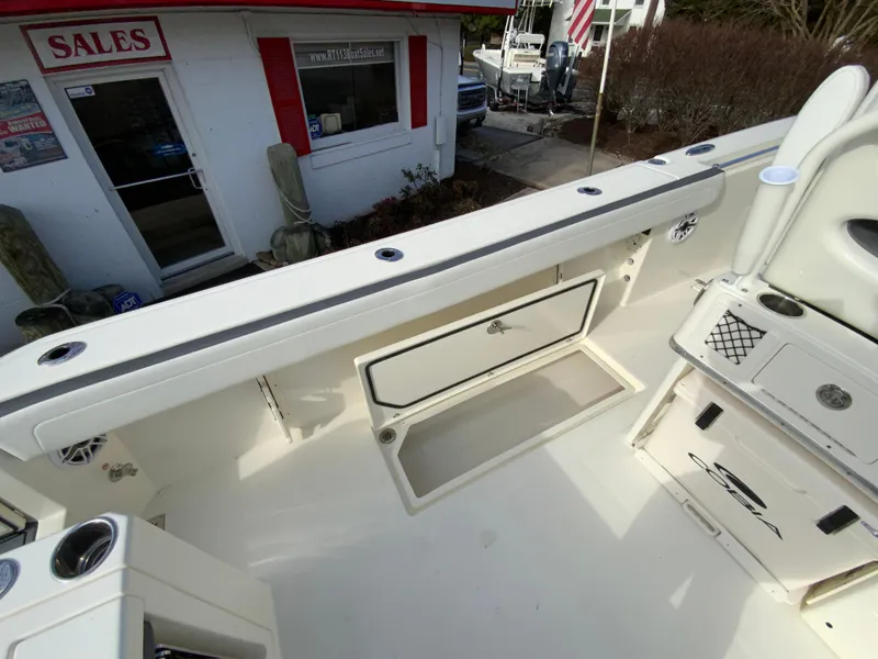 Slide: The Image of 2025 Cobia 285 Open Center Console boat interior at sales location. - 34