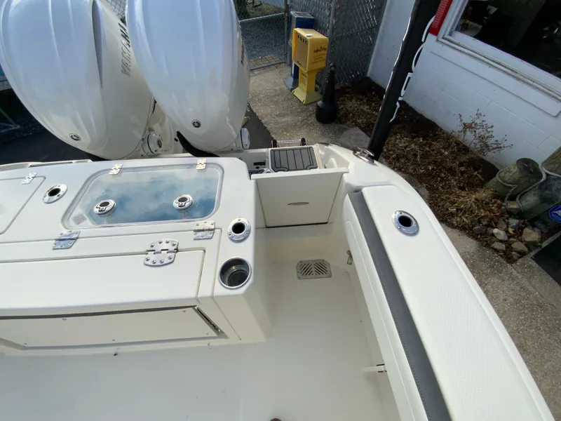 Slide: The Image of 2025 Cobia 285 Open Center Console boat with dual engines and spacious deck layout. - 36