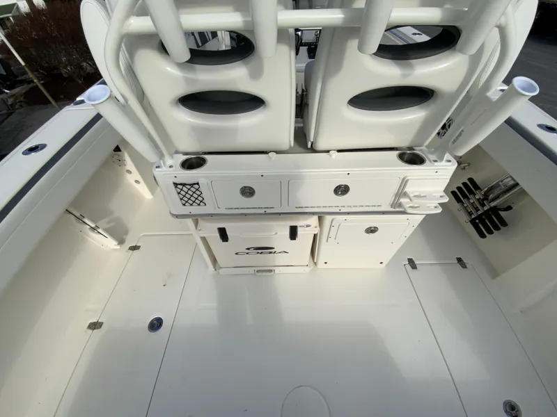 Slide: The Image of 2025 Cobia 285 Open Center Console boat interior with seating and storage compartments. - 41